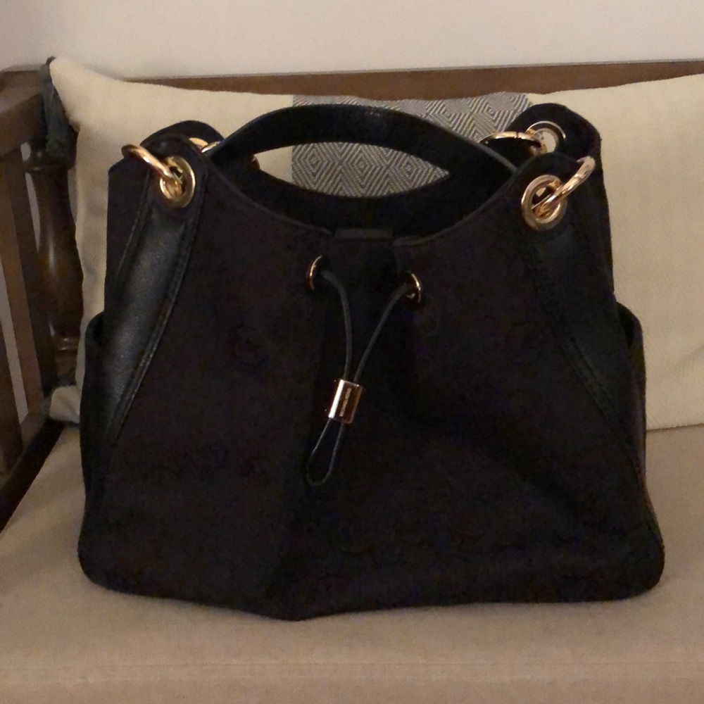 Lovely purse, spacious and light weight.